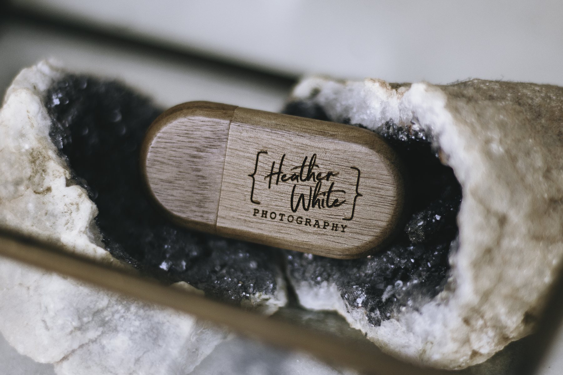 An engraved memory stick set into a polished geode, in its presentation box